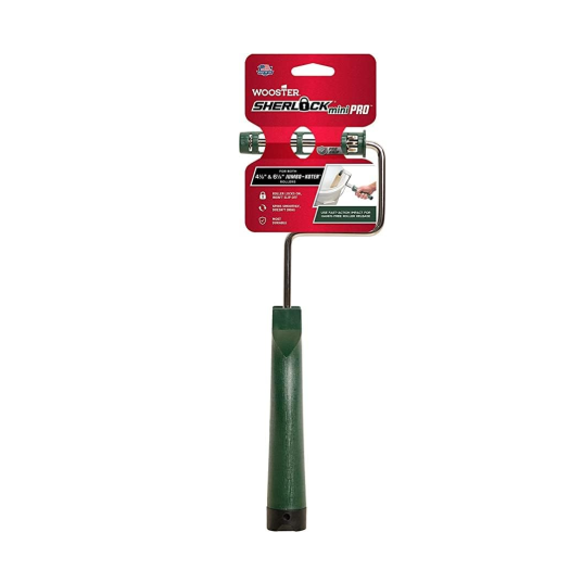 The WOOSTER RR013 Sherlock Mini Jumbo-Koter Frame 12 in. features a green handle and vibrant packaging, showcasing its ideal use for small or detailed painting tasks. Compatible with the Jumbo-Koter Frame, it adds versatility for any paint job.